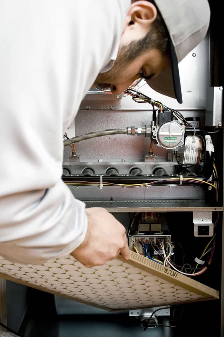 technician servicing hvac