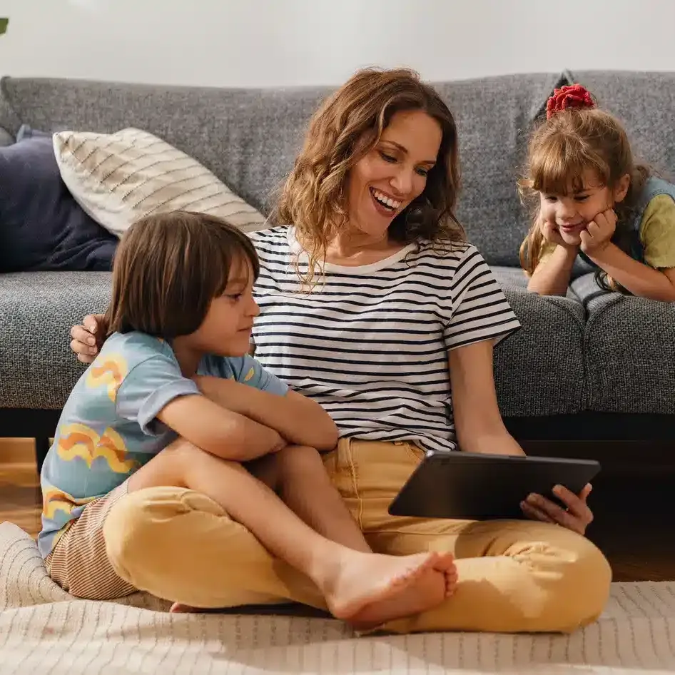 family looking at tablet cropped