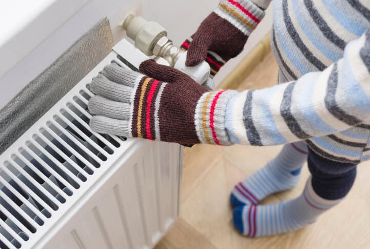 person next to heater