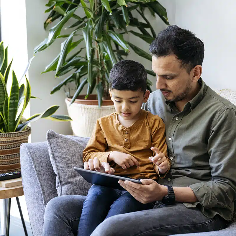 parent showing child ipad